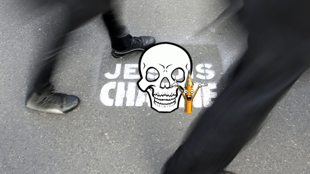 People walk past a grafitti tag reading "I am Charlie" as they take part in a solidarity march (Marche Republicaine) in the streets of Paris